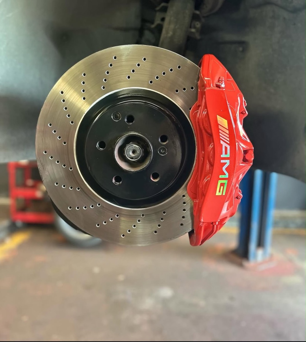 Red AMG caliper on brake rotor