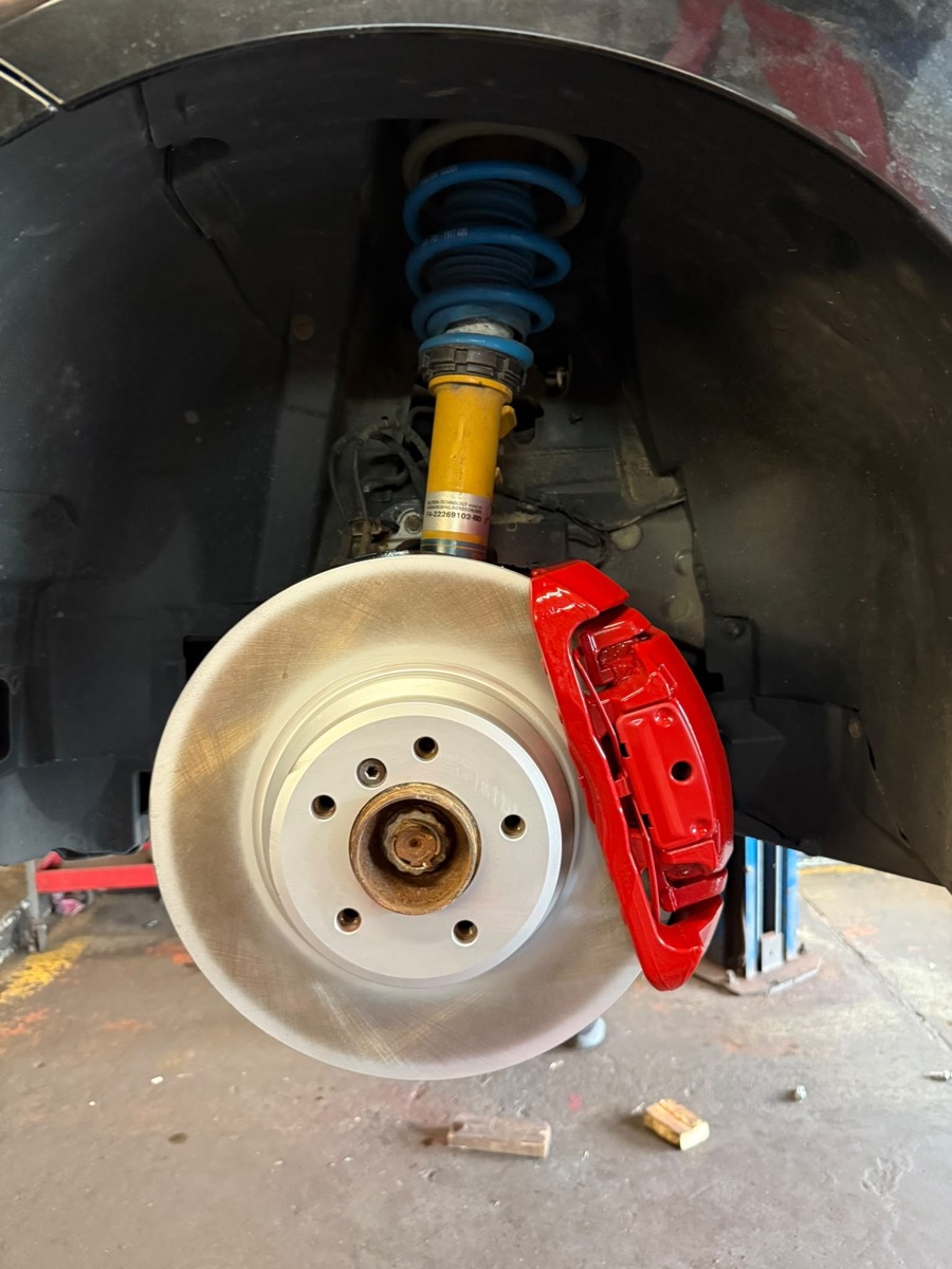 Red caliper with blue performance coilover